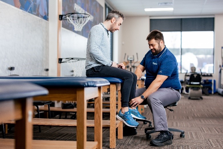 Physical therapist with patient